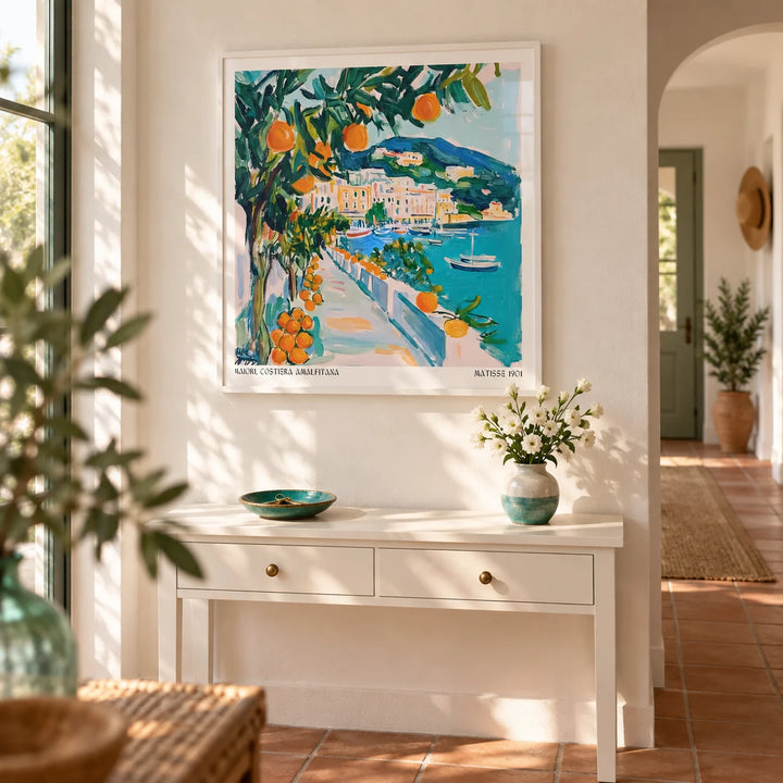 Art Prints of Italy, framed on the wall of a bright hallway with a warm white wall and plain terracotta floor tiles