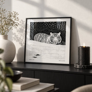 Art White Tiger, a small A4 framed print leaning on a black shelf in a living room