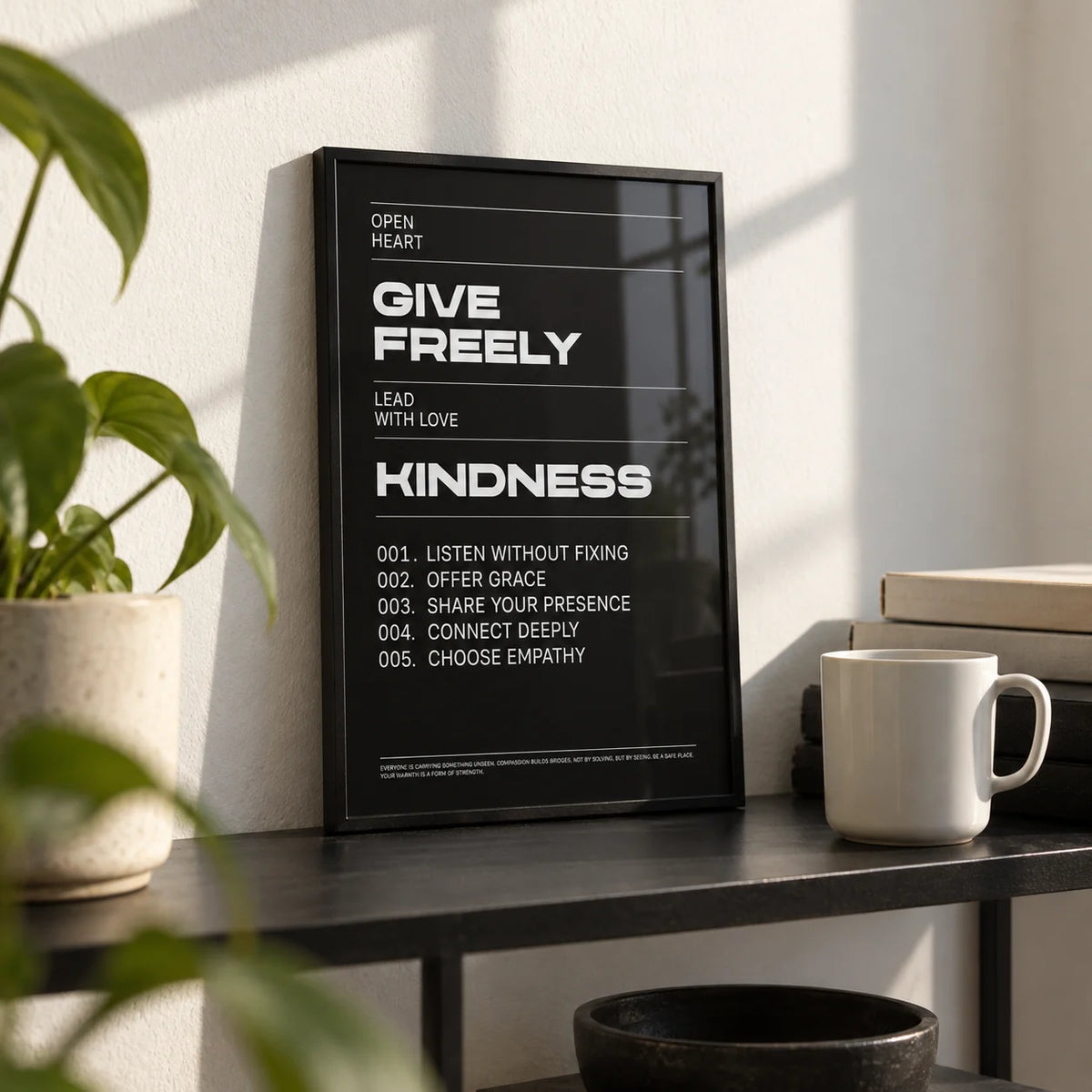 Art with Quote, a small A4 framed print leaning on a black metal shelf in a living room