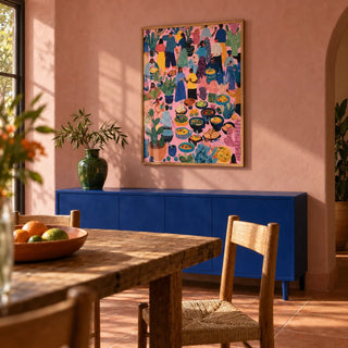 Artwork from Mexico, framed on the wall of a warm Mexican-modern dining room