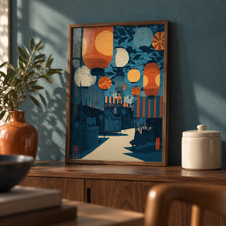 Asian Festival Art Print, a small A4 framed print leaning on a walnut sideboard in a living room