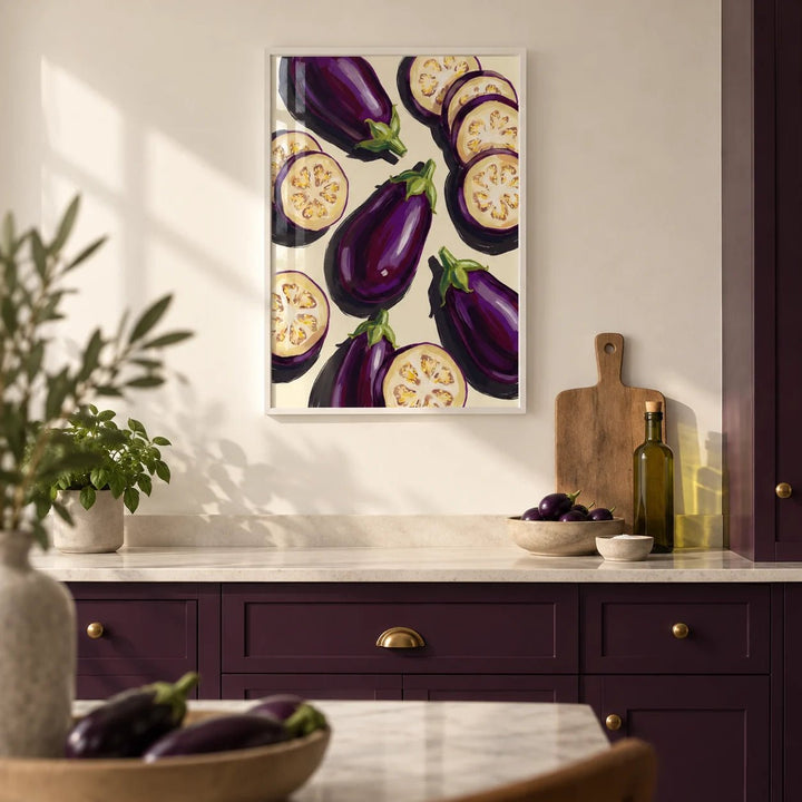 Aubergines Art Print, framed on the wall of a modern kitchen with solid deep aubergine painted cabinets and a plain cream wall