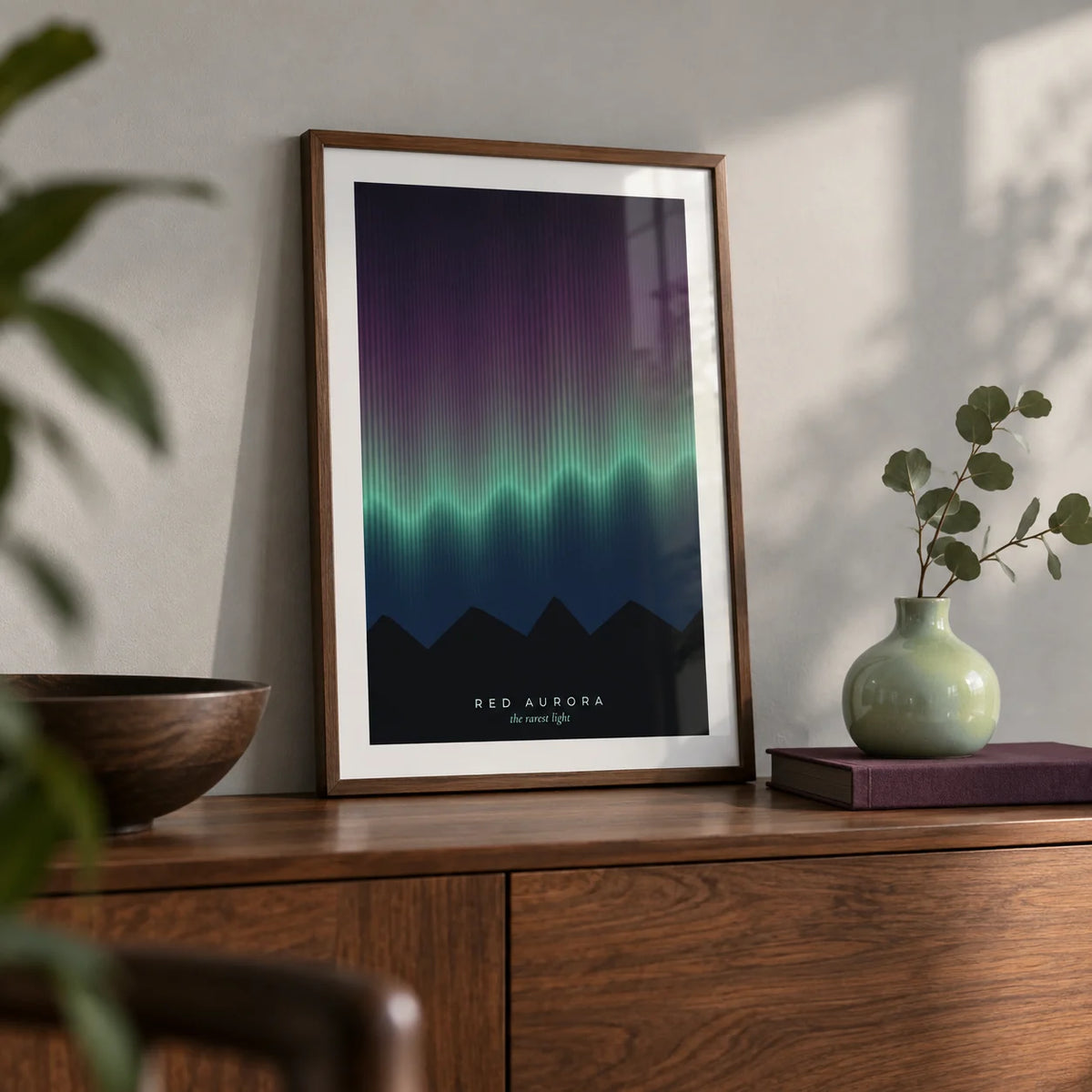 Aurora Print, a small A4 framed print leaning on a walnut sideboard in a living room