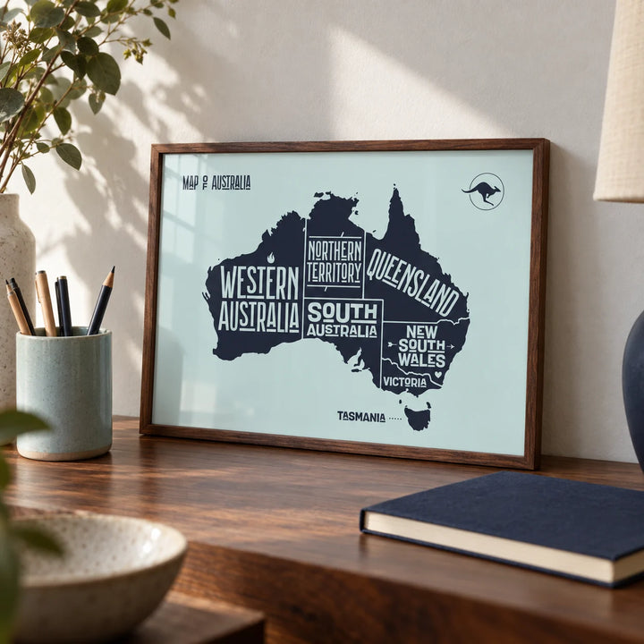 Australia Map Print, a small A4 framed print leaning on a walnut desk