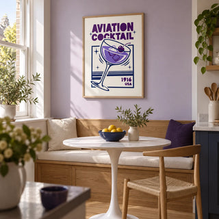 Aviation Cocktail Print, framed on the wall of a bright kitchen breakfast nook in a renovated UK terrace with a lavender painted wall and pale oak flooring