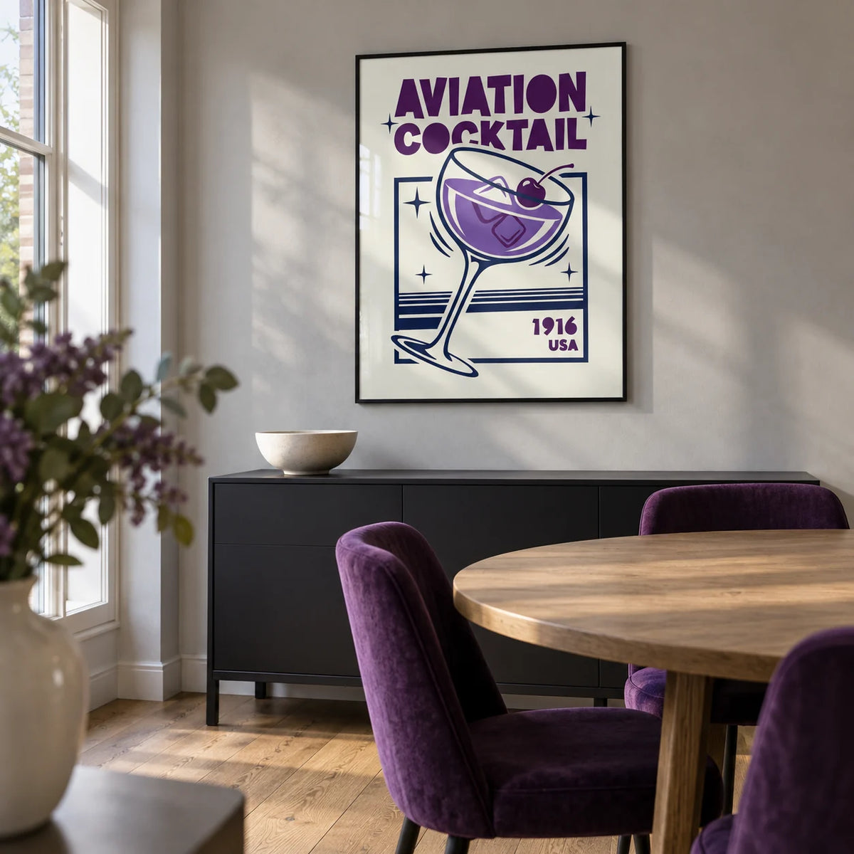 Aviation Cocktail Print, framed on the wall of a contemporary dining room in a UK maisonette with pale grey plaster walls and oak floorboards