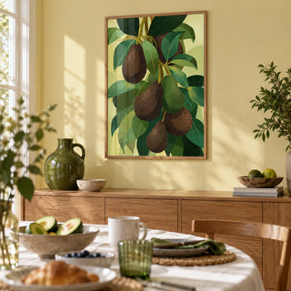 Avocado Wall Art, framed on the wall of a light dining room with a pale yellow wall