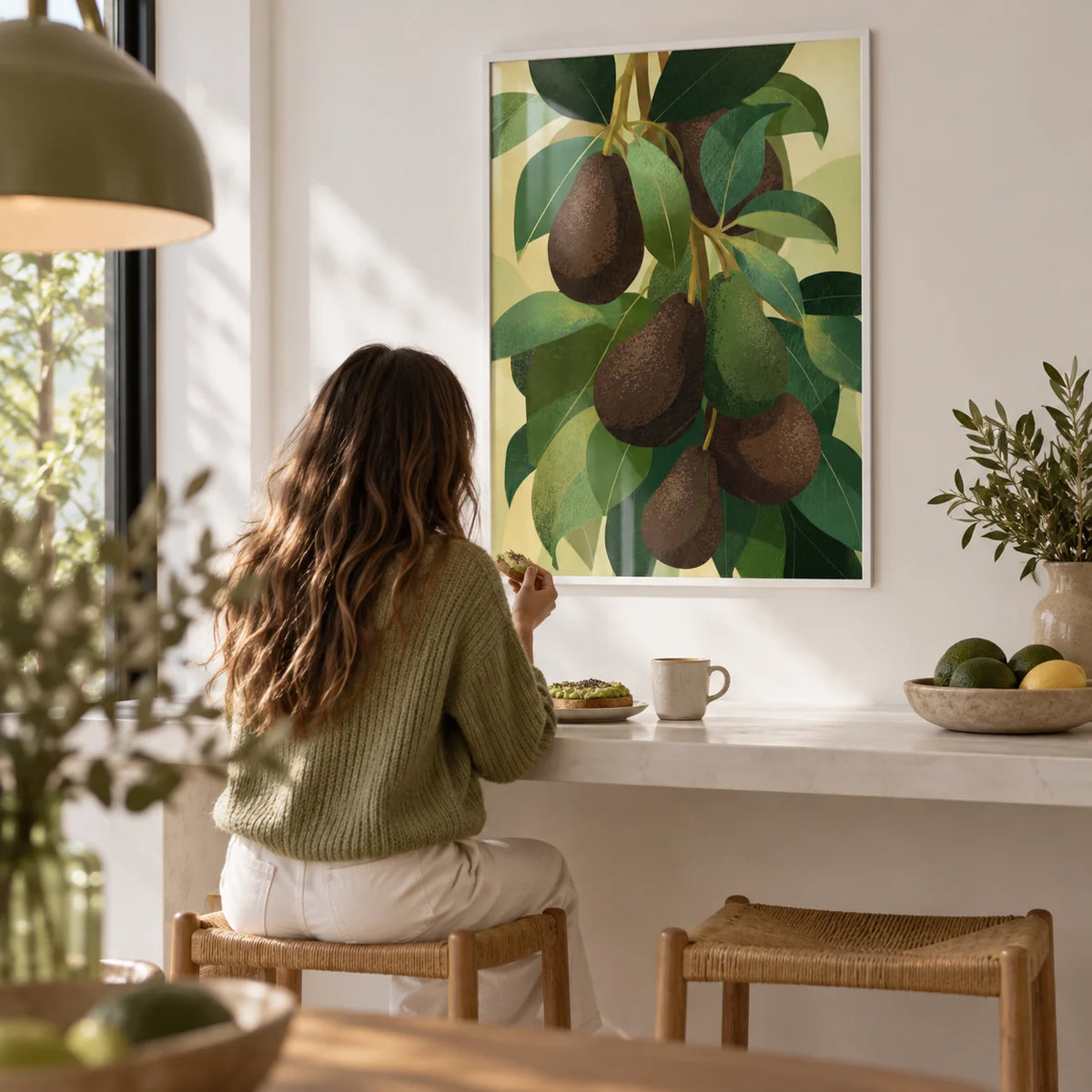 Avocado Wall Art, framed on the wall of a modern breakfast bar with a white wall in a kitchen