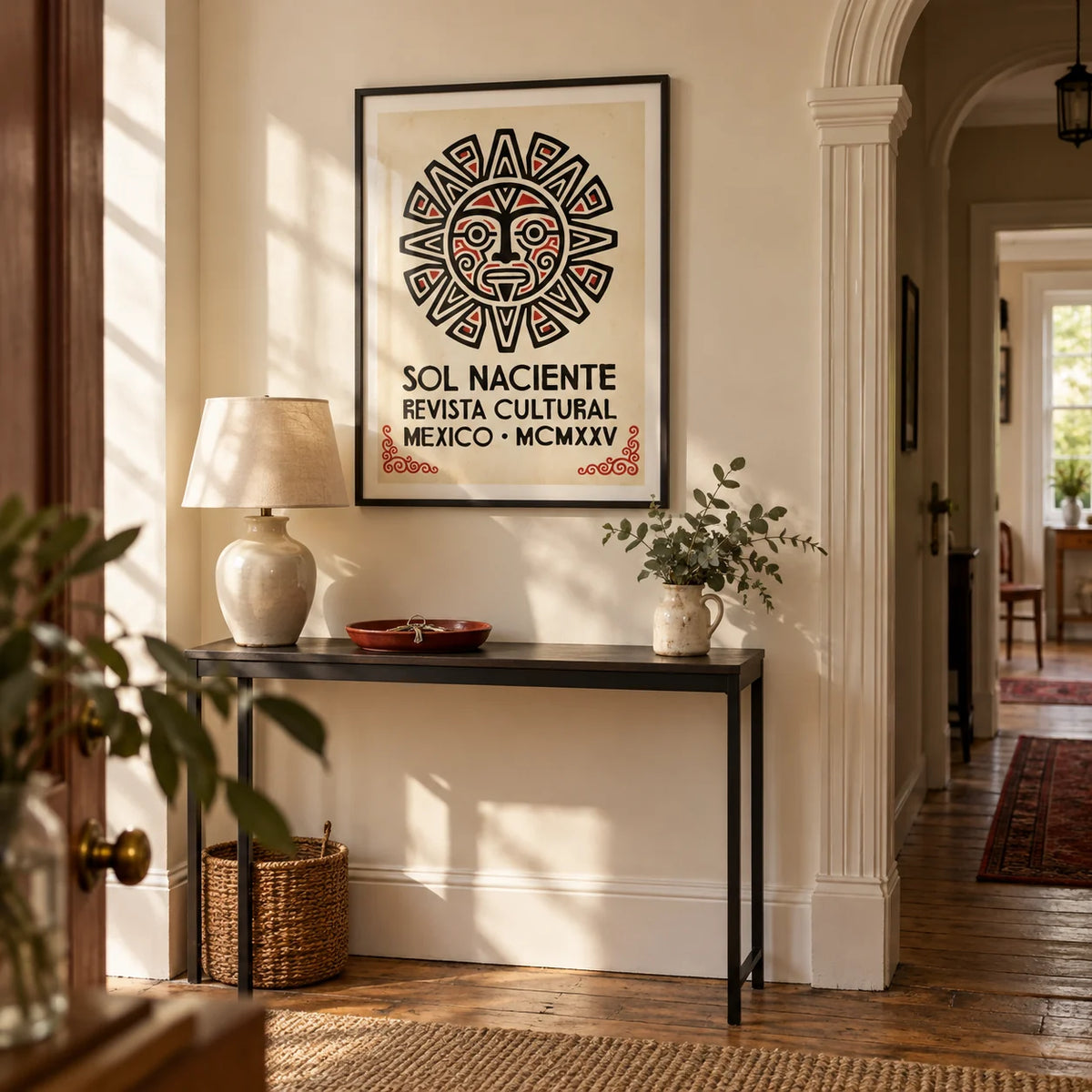 Aztec Sun Illustration Art Print, framed on the wall of a welcoming hallway in a UK period flat with warm cream walls and an arched doorway