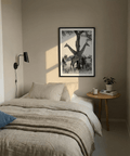 Minimal photography wall art featuring giraffes with patterned coats and open sky