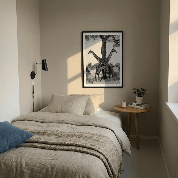 Minimal photography wall art featuring giraffes with patterned coats and open sky