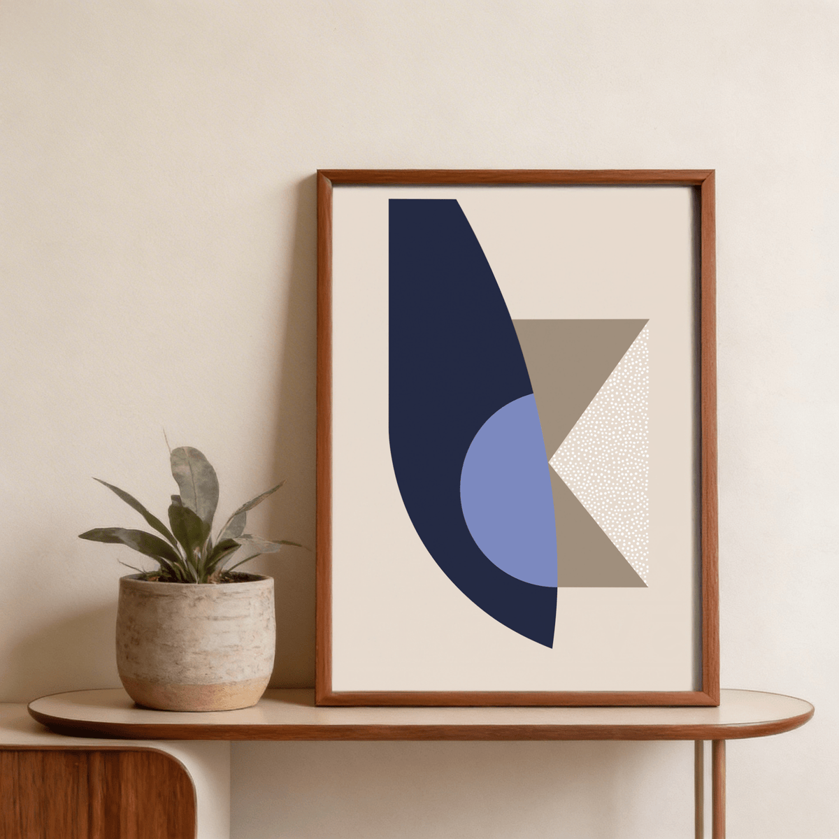 Modern abstract print showing bold arc, half-circle overlap, and speckled panel