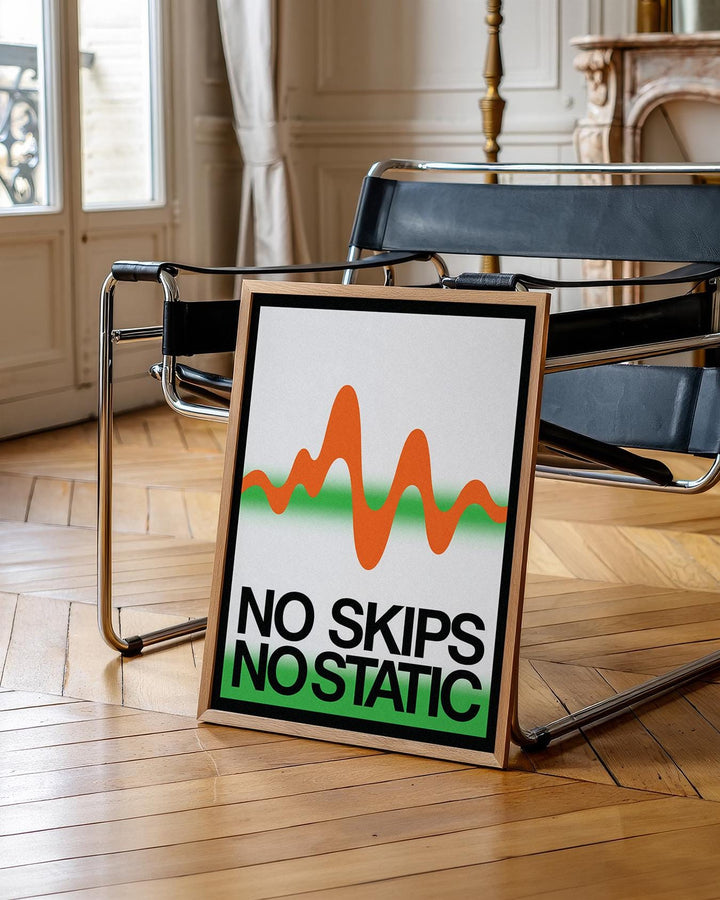 Retro Music Poster leaning on a modern black chair with an orange waveform and green gradient