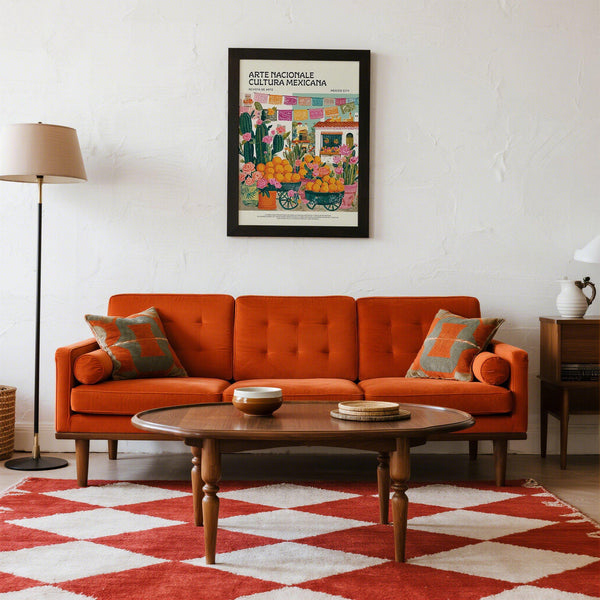 Papel picado banner above oranges and cactus in colorful Mexican kitchen wall art.