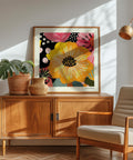 Square wall art featuring a bold yellow flower illustration.