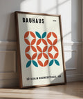 Modern geometric wall art with teal and rust circle pattern on cream background.