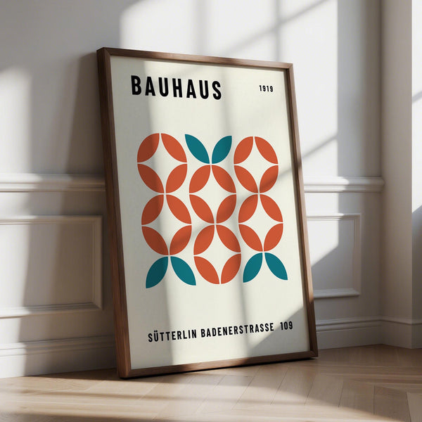 Modern geometric wall art with teal and rust circle pattern on cream background.