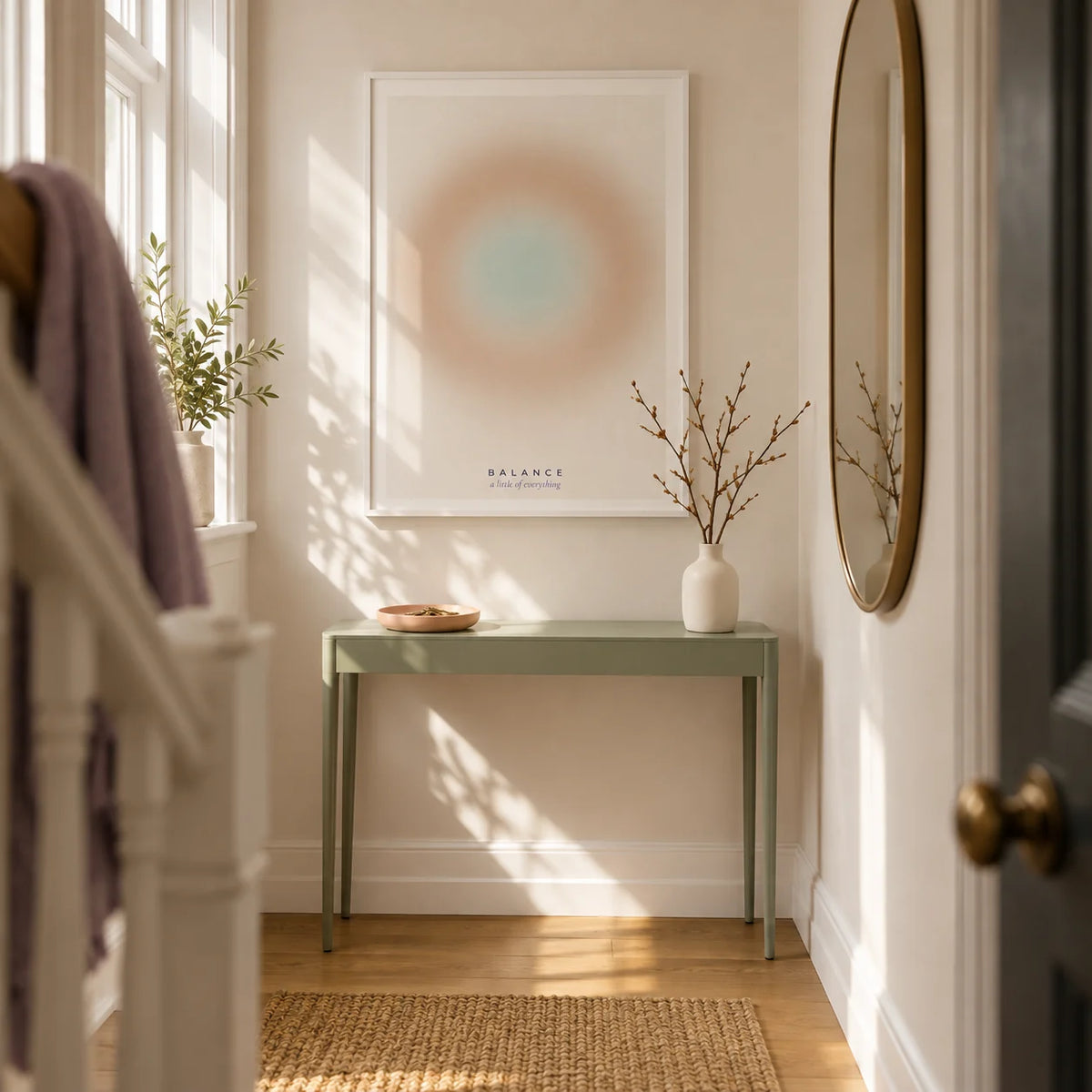 Balance Print, framed on the wall of a welcoming narrow hallway in a renovated UK terrace with warm white walls and an oak floor