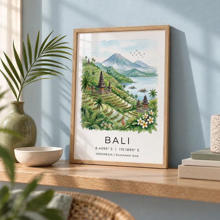 Bali Landscape Art Print, a small A4 framed print leaning on a pale oak shelf in a living room
