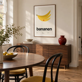 Bananas Wall Art, framed on the wall of a design-led dining room in a Victorian terrace with warm white walls and an oak floor