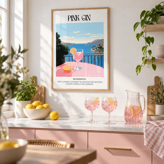Bar Cart Art, framed on the wall of a bright kitchen with plain blush pink cabinets and a white worktop