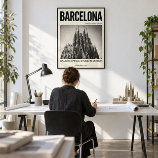 Barcelona Architecture Poster, framed on the wall of an architect's home studio with a white wall and a concrete floor in a home office