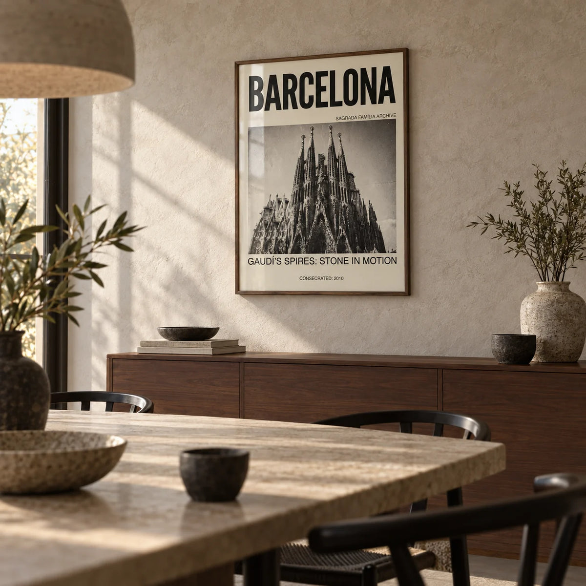 Barcelona Architecture Poster, framed on the wall of a calm dining room with a limewashed stone wall