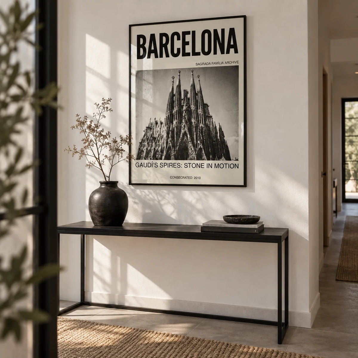 Barcelona Architecture Poster, framed on the wall of a modern hallway with a white wall