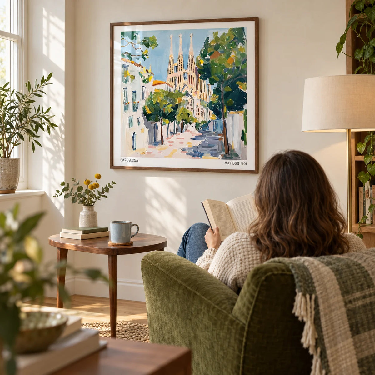 Barcelona Boulevard Poster, framed on the wall of a relaxed reading corner in a travel-loving adult's UK flat with a cream wall and oak floor in a living room