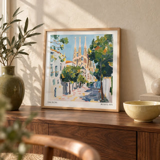 Barcelona Boulevard Poster, a small A4 framed print leaning on a walnut side table in a hallway