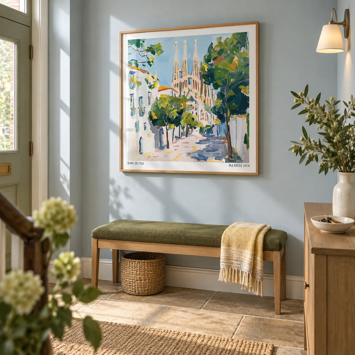 Barcelona Boulevard Poster, framed on the wall of a welcoming hallway in a renovated UK terrace with pale blue walls and warm stone flooring