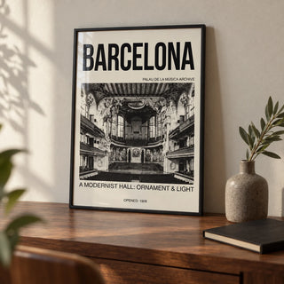 Barcelona Concert Hall Poster, a small A4 framed print leaning on a walnut desk