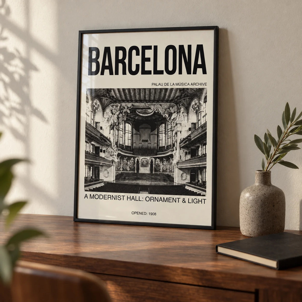 Barcelona Concert Hall Poster, a small A4 framed print leaning on a walnut desk