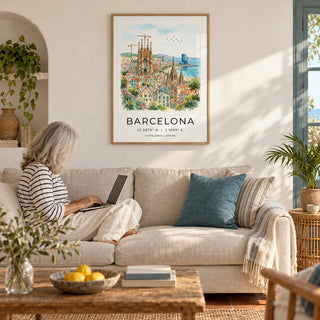 Barcelona Watercolor Poster, framed on the wall of a bright Mediterranean living room with white plaster walls and a terracotta floor