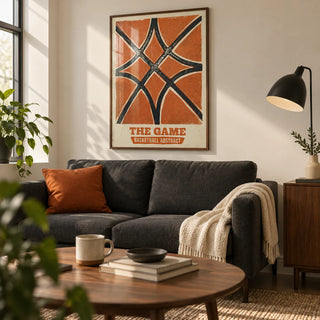 Basketball Abstract Print, framed on the wall of a compact design-led living room in a first UK flat (22-28) with warm white walls and a walnut coffee table