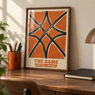 Basketball Abstract Print, a small A4 framed print leaning on a walnut desk