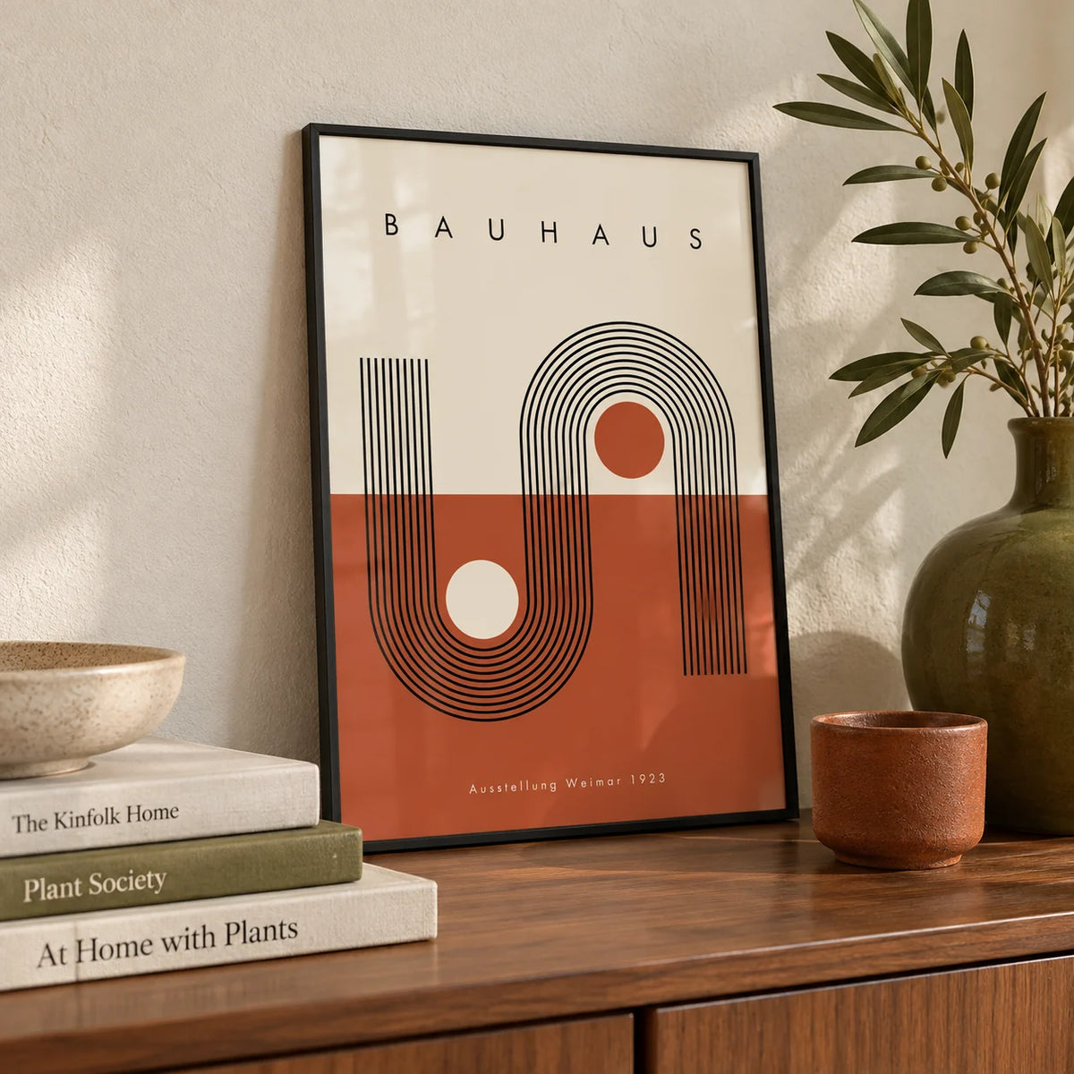 Terracotta Bauhaus Poster, a small A4 framed print leaning on a walnut sideboard in a living room