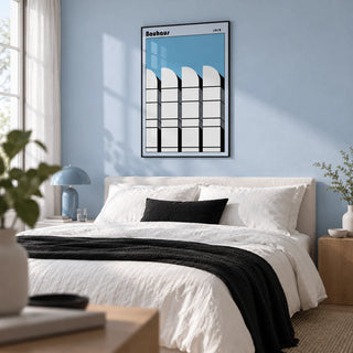 Bauhaus Architecture Art Poster, framed on the wall of a calm modern bedroom with a pale blue wall