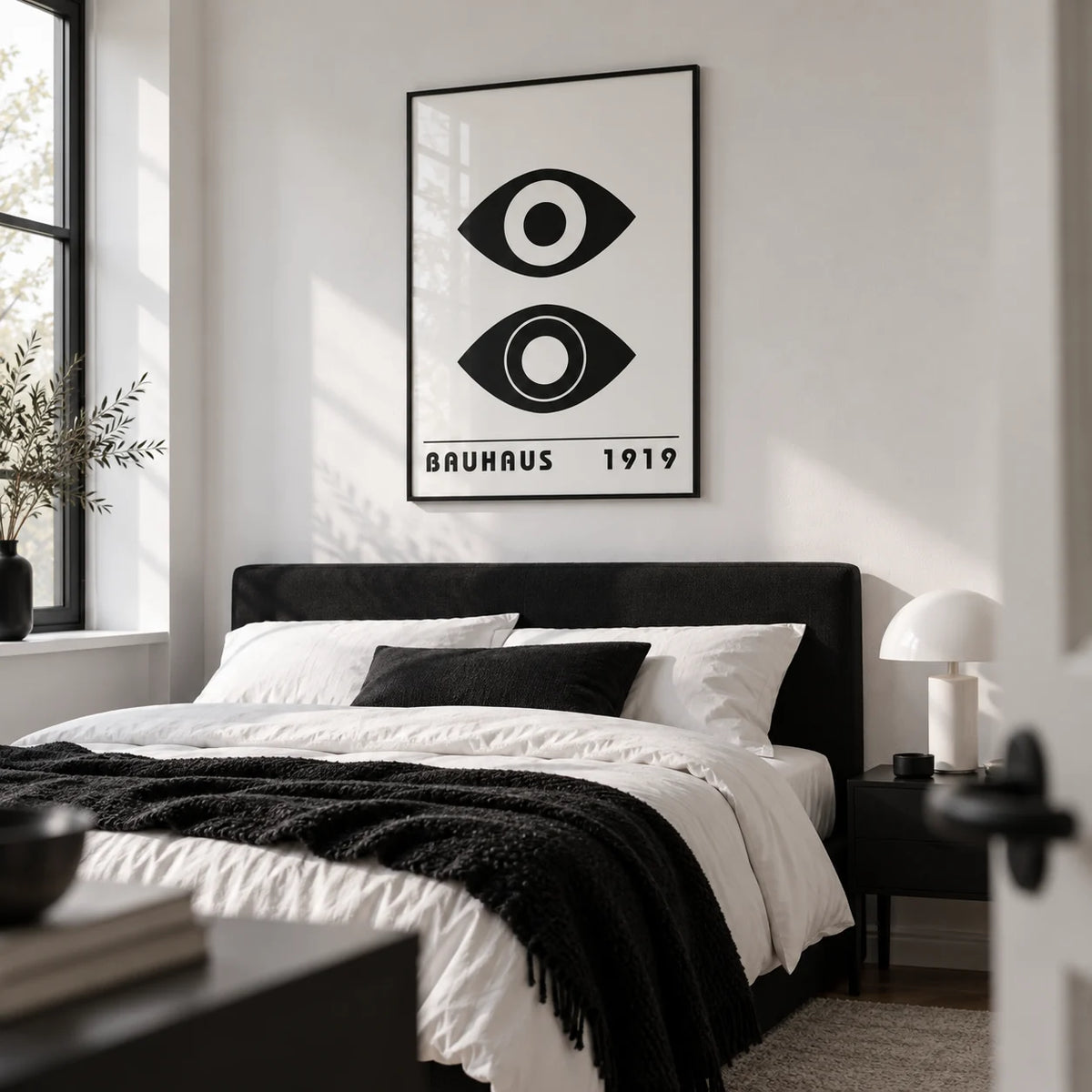 Bauhaus Art Print, framed on the wall of a monochrome bedroom with a white wall