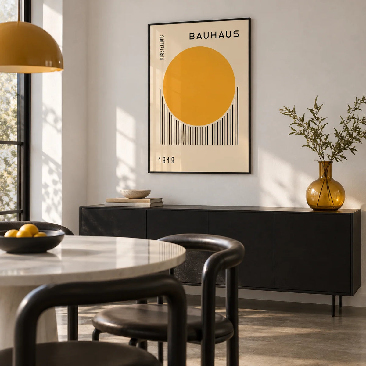 Bauhaus Art Prints, framed on the wall of a modern dining room with a white wall and a polished concrete floor