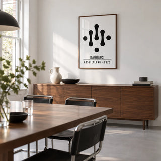Bauhaus Art Black and White, framed on the wall of a crisp modern dining room in a renovated UK terrace with white walls and a plain pale grey floor