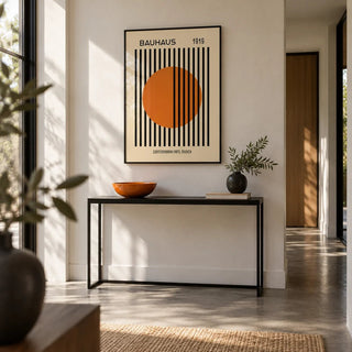 Bauhaus Decor, framed on the wall of a modern hallway with a concrete floor