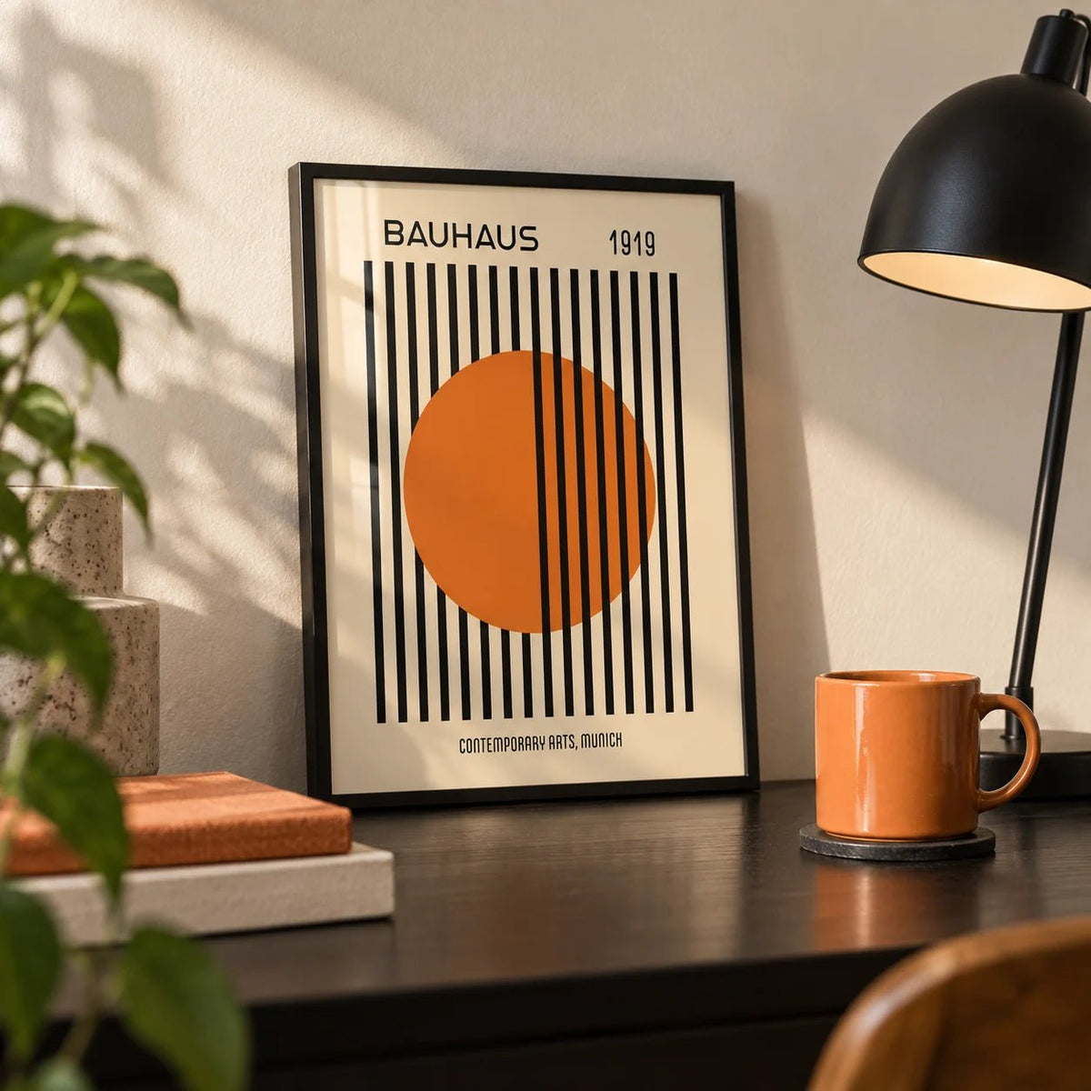 Bauhaus Decor, a small A4 framed print leaning on a black desk