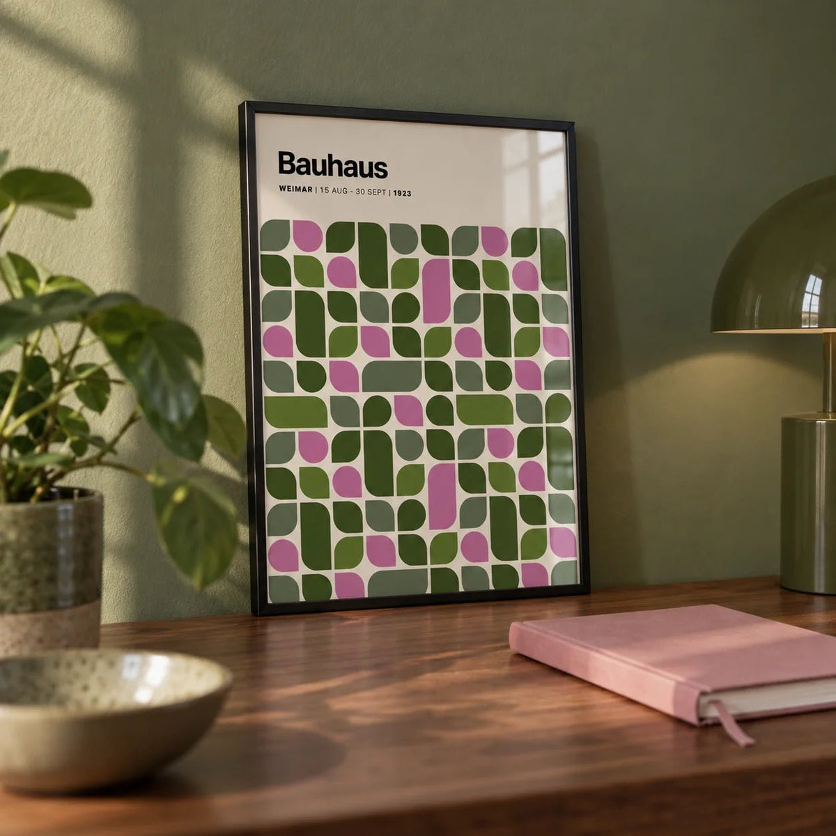 Bauhaus Exhibition 1923 Print, a small A4 framed print leaning on a walnut desk