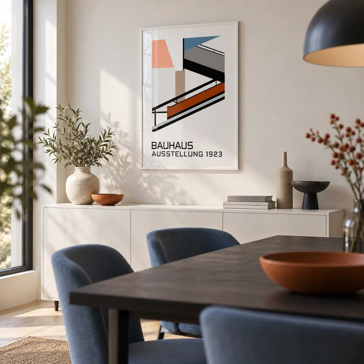 Bauhaus Exhibition Poster 1923, framed on the wall of a crisp modern dining room