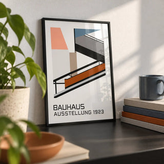 Bauhaus Exhibition Poster 1923, a small A4 framed print leaning on a black desk