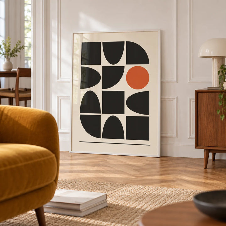 Bauhaus Geometric Shapes, framed on the wall of a bright room with white panelled walls and a herringbone floor in a living room