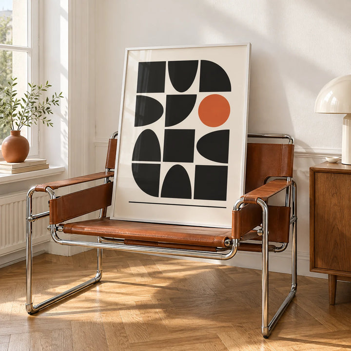 Bauhaus Geometric Shapes, framed on the wall of a bright white room with tall white walls and warm herringbone oak parquet in soft morning light in a living room