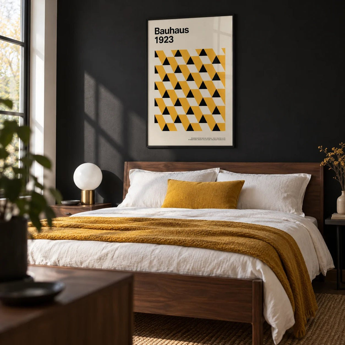 Bauhaus Poster 1923, framed on the wall of a crisp modern bedroom with a solid black painted wall behind the bed