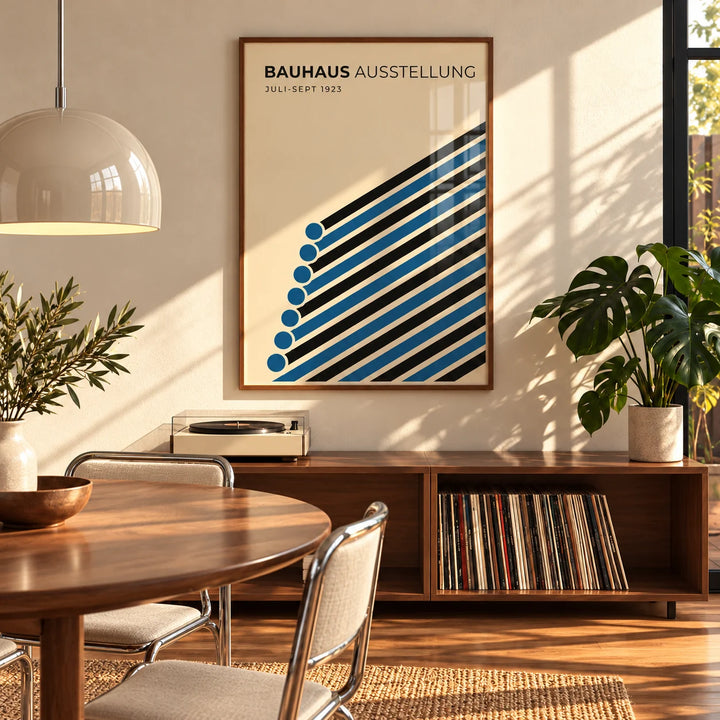 Bauhaus Print, framed on the wall of a mid-century dining room with a round walnut table
